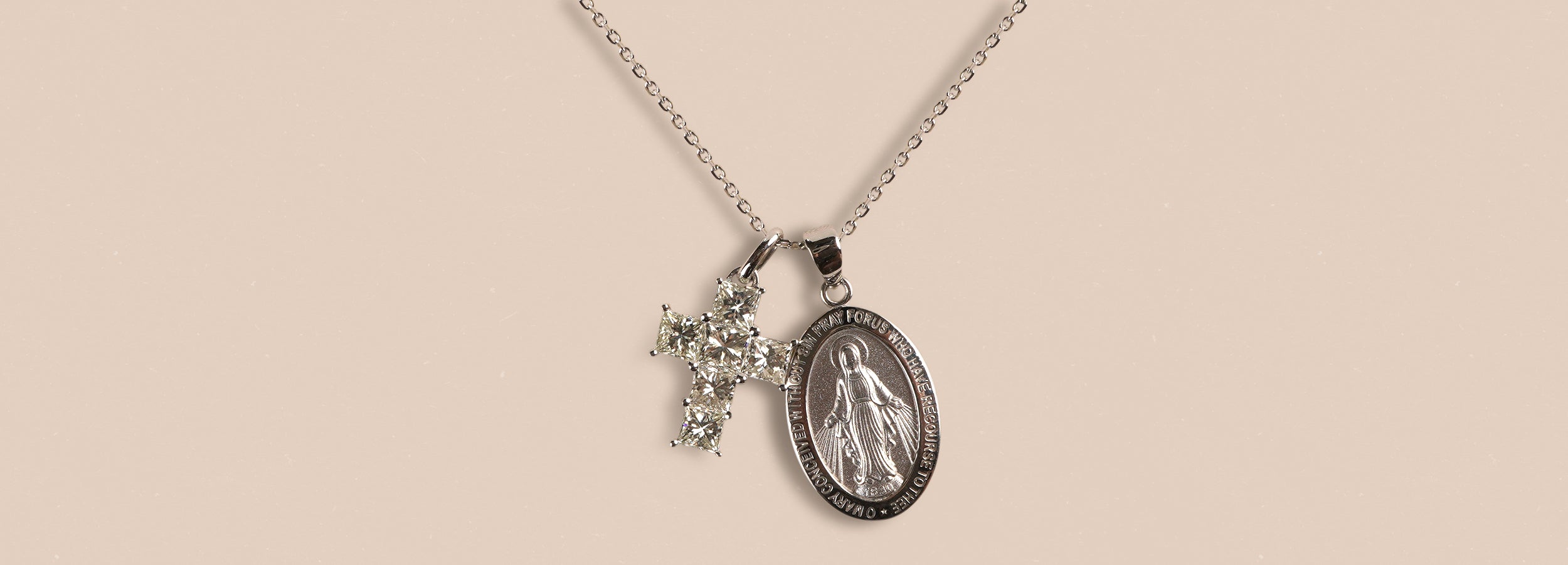 Necklace with a religious pendant on a beige background