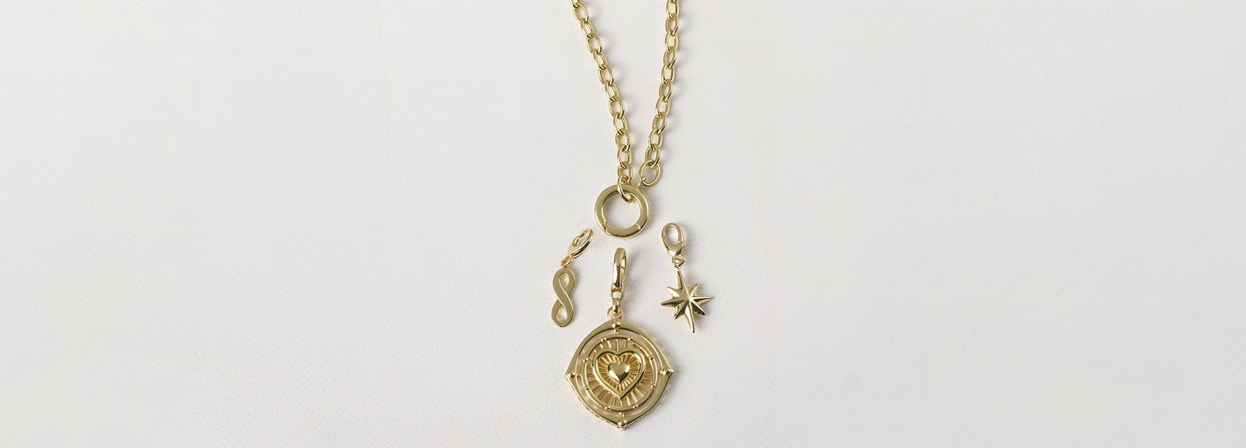 Gold Charm Necklaces: The Meaningful Jewelry Trend to Wear Now