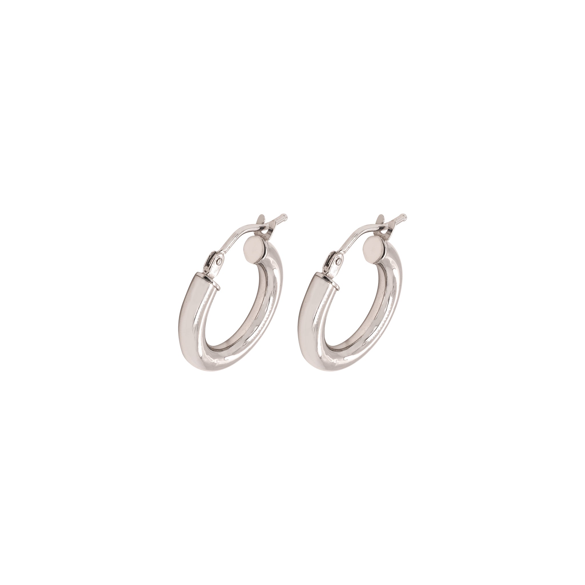 Pair of white gold hoop earrings on a white background
